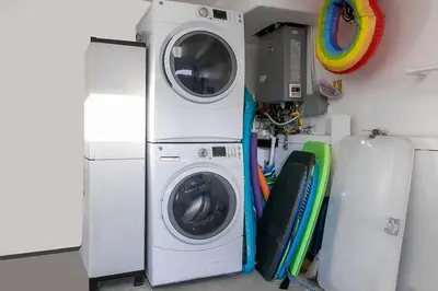 a washing machine and a dryer in a room at Stunning South Mission Home with Private Rooftop & Ocean Views! in San Diego