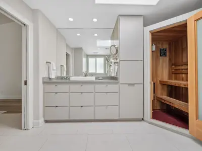 a bathroom with a sink and a mirror at Windansea Beach Luxury - Spa, AC, Walk2Beach, Garage & fast WiFi in San Diego