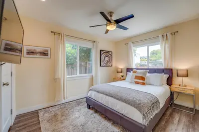 a bedroom with a bed and a ceiling fan at La Jolla Oasis - Pet Friendly, Large Backyard, Walk2Beach & Location! in San Diego
