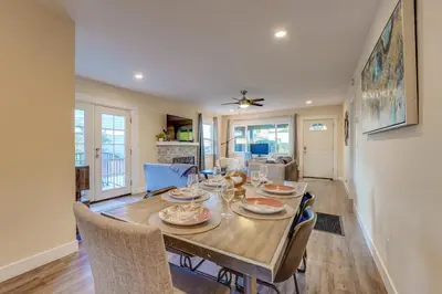 a dining room and living room with a table and chairs at La Jolla Oasis - Pet Friendly, Large Backyard, Walk2Beach & Location! in San Diego