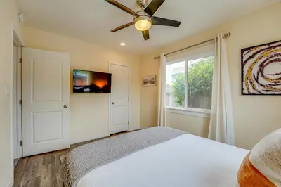 a bedroom with a bed and a ceiling fan at La Jolla Oasis - Pet Friendly, Large Backyard, Walk2Beach & Location! in San Diego