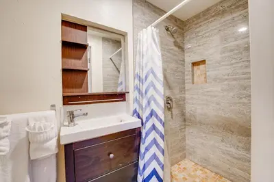 a bathroom with a sink and a shower at La Jolla Oasis - Pet Friendly, Large Backyard, Walk2Beach & Location! in San Diego