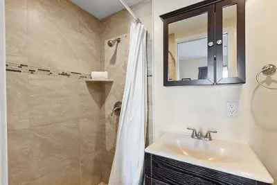 a bathroom with a sink and a shower at Riviera Bay View Dream - Private patio with bay view and parking in San Diego