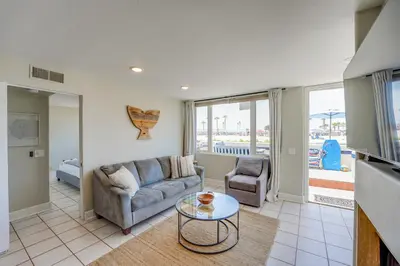 a living room with a couch and a table at Oceanfront Condo with Front Patio, Gas Grill, Fire Pit - Prime Location!! in San Diego