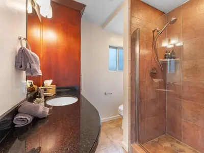 a bathroom with a sink and a shower at Ocean View Beach Haven! Steps2Beach & Pet Friendly in San Diego