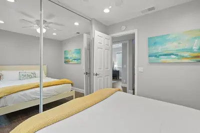 a bedroom with two beds and a ceiling fan at Stunning Beach Home with Fireplace, Fast WiFi, Grill & Outdoor Seating! in San Diego