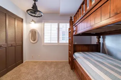 a bedroom with a bunk bed and a window at Bayfront Paradise- Bay Views & Boardwalk Patio in San Diego