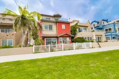 a row of houses with a white fence at Bayfront Paradise- Bay Views & Boardwalk Patio in San Diego