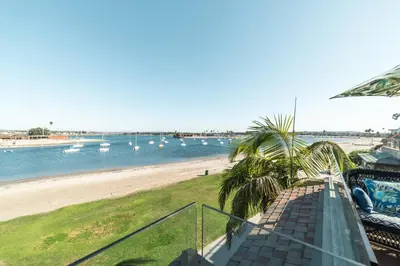 a view of a beach with boats in the water at Bayfront Dream - Bay Views, Rooftop Patio, & Garage! in San Diego