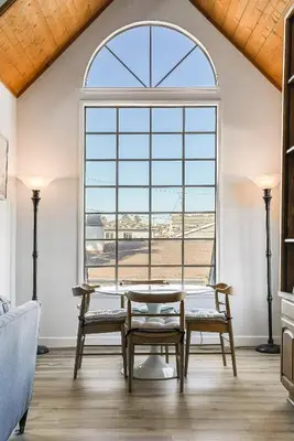 a dining room with a table and a large window at Ormond Retreat w Ocean View, Steps2beach & Garage in San Diego