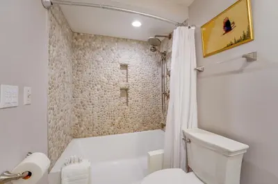 a white bathroom with a toilet and a shower at Bayfront Paradise - Flexible 30 Day plus w Amazing Bay View and Pool in San Diego