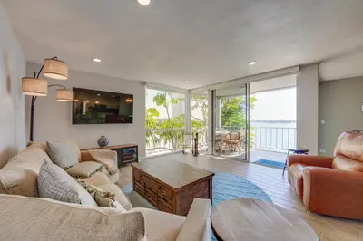 a living room with a couch and a table at Bayfront Paradise - Flexible 30 Day plus w Amazing Bay View and Pool in San Diego
