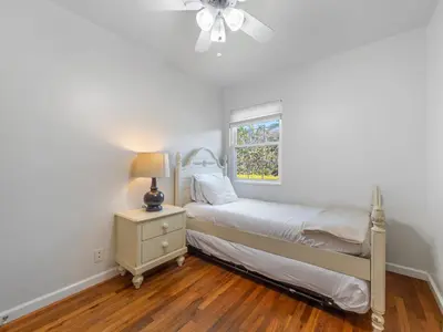a white bedroom with a bed and a window at La Jolla Ocean Dream - Walk 2 Beach - Dog Friendly in San Diego