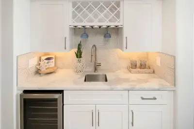 a kitchen with a sink and a counter top at Oceanfront Home with Stunning View in Oceanside