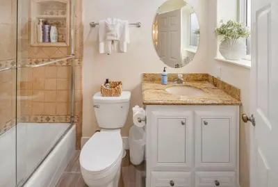 a bathroom with a toilet and a sink and a shower at Oceanfront Home with Stunning View in Oceanside
