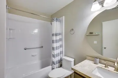 a bathroom with a toilet and a sink and a shower at Downtown San Diego Condo 1 Mi to Gaslamp Quarter in San Diego