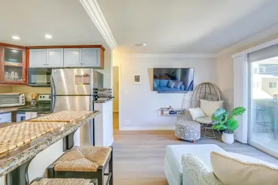 a kitchen and living room with a counter top at Sunny Imperial Beach Condo - Walk to Ocean! in Imperial Beach