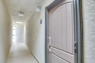 a door leading to a hallway with at Sunny Imperial Beach Condo - Walk to Ocean! in Imperial Beach