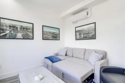 a living room with a couch and a table at Park Blvd 301 - Modern - Urban Oasis - SPA in San Diego