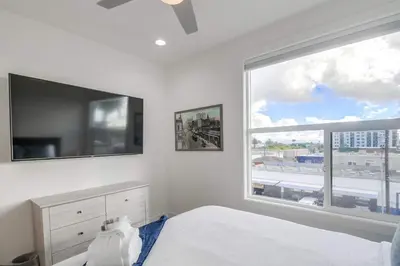 a bedroom with a bed and a large window at Park Blvd 302 - Newly Built - Spa - Central in San Diego