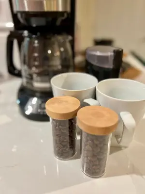 three coffee cups sitting on a counter next to cups at Mile to Beach! Tiki Master Suite in Oceanside