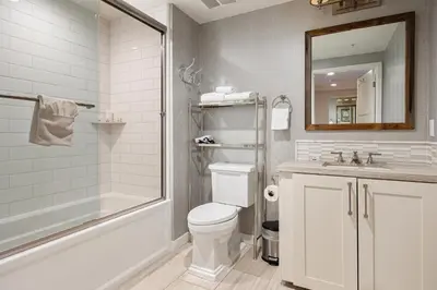 a bathroom with a toilet and a shower and a sink at Escape to Neptune in San Diego