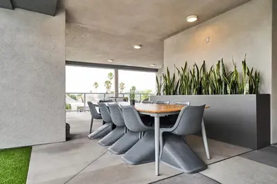 a dining room with a table and chairs and plants at Luxury 2BD 2BA, BRAND NEW/PETS/CLOSE TO EVERYTHING/BOHO+COZY VIBES in San Diego