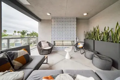 a living room with a couch and some plants at Luxury 2BD 2BA, BRAND NEW/PETS/CLOSE TO EVERYTHING/BOHO+COZY VIBES in San Diego