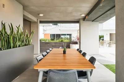 a dining room with a wooden table and chairs at Luxury 2BD 2BA, BRAND NEW/PETS/CLOSE TO EVERYTHING/BOHO+COZY VIBES in San Diego