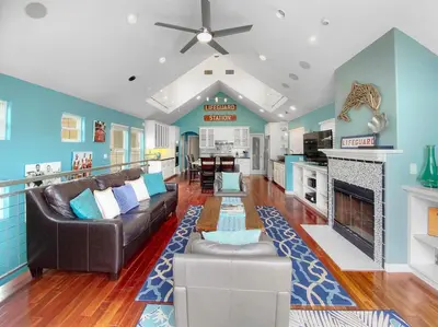 a living room with a couch and a fireplace at Massive Mission Beach Home - Fire Pit & Deck in San Diego