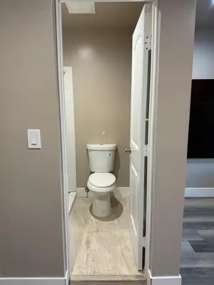 a bathroom with a white toilet in a room at Valley Motel El Cajon San Diego in El Cajon