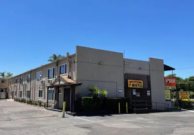 an empty parking lot in front of a building at Valley Motel El Cajon San Diego in El Cajon