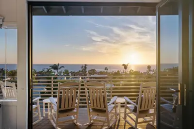 a balcony with chairs and a view of the ocean at CBS-2369 - Cardiff Panoramic Paradise in Cardiff-by-the-Sea