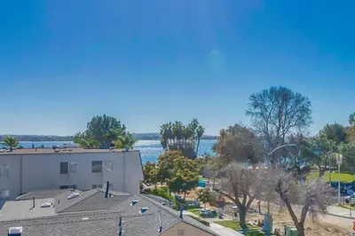 arial view of a building and a body of water at Bay View Dream - Steps to Bay, Rooftop Patio & AC in San Diego