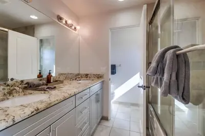 a bathroom with a sink and a shower at Bay View Dream - Steps to Bay, Rooftop Patio & AC in San Diego