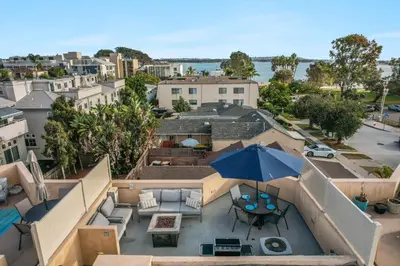 an overhead view of a patio with an umbrella at Bay View Dream - Steps to Bay, Rooftop Patio & AC in San Diego
