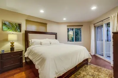 a bedroom with a large bed and a window at Bay View Dream Home - IndoorOutdoor Living, Rooftop & Steps to Bay in San Diego