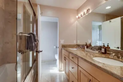 a bathroom with a double sink and a shower at Bay View Dream Home - IndoorOutdoor Living, Rooftop & Steps to Bay in San Diego