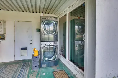 a room with two washing machines in a building at Spacious Home with Yard about 7 Mi to Dtwm San Diego! in San Diego
