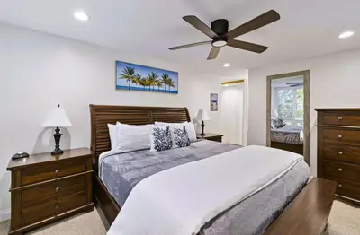 a bedroom with a bed and a ceiling fan at Brooks Beach Vacations Bungalow B116 Oceanside in Oceanside