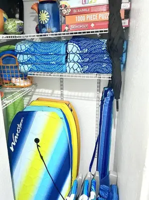 a refrigerator filled with lots of different colored surfboards at Brooks Beach Vacations Bungalow B116 Oceanside in Oceanside