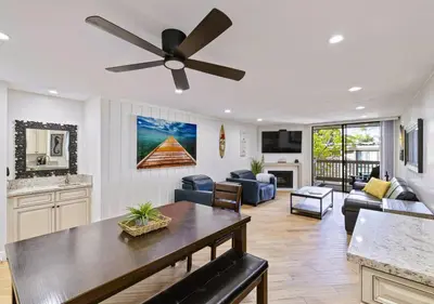 a living room with a ceiling fan at Brooks Beach Vacations Bungalow B116 Oceanside in Oceanside