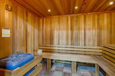 a sauna with a bench in a wooden room at Brooks Beach Vacations Villa C205 Oceanside in Oceanside