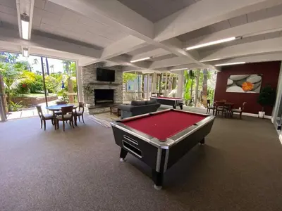 a living room with a pool table in it at Brooks Beach Vacations Cottage G5 Oceanside in Oceanside