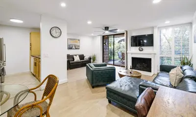 a living room with a couch and a fireplace at Brooks Beach Vacations Cottage G5 Oceanside in Oceanside