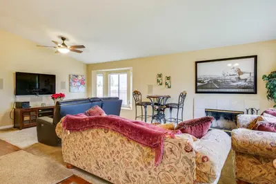 a living room with a couch and a fireplace at Peaceful El Cajon Vacation Rental with Patio and Yard! in El Cajon
