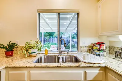 a kitchen with a sink and a window at Peaceful El Cajon Vacation Rental with Patio and Yard! in El Cajon