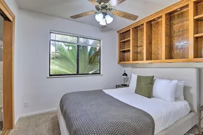 a bedroom with a bed and a ceiling fan at Charming Temecula Home with Hot Tub, Mountain Views! in Temecula