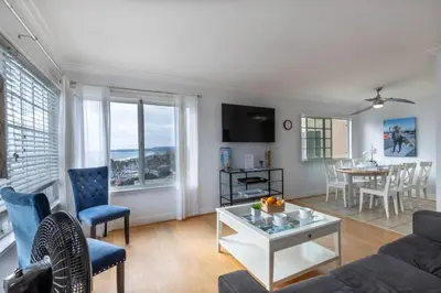 a living room with a couch and a table at Ocean View Hideaway Unit #3 in San Clemente