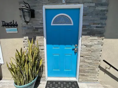 a blue door with a picture of a mountain on it at Ocean View Hideaway Unit #3 in San Clemente